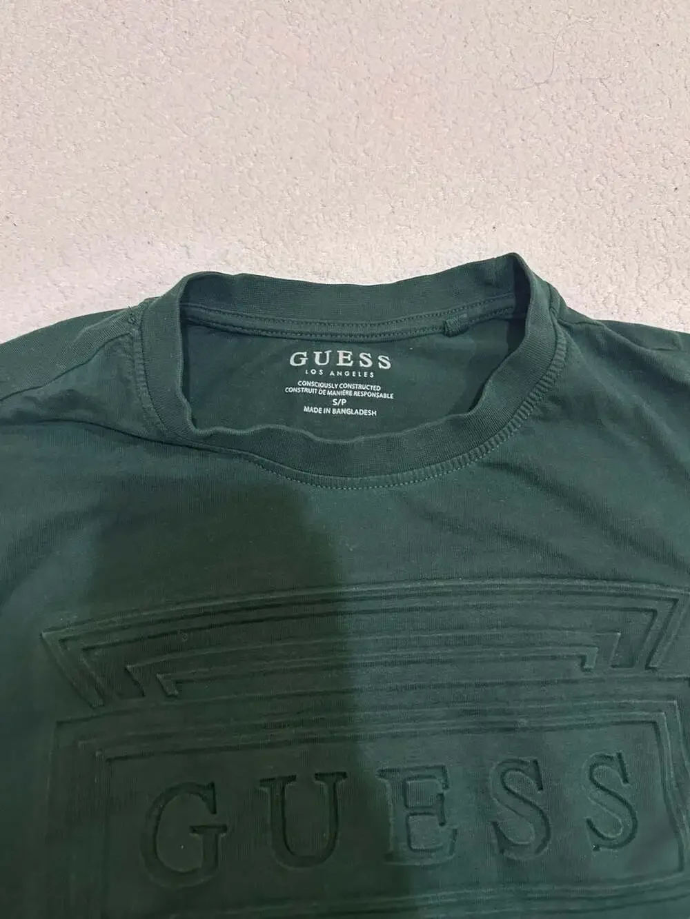 GUESS Men's Eco Short Sleeve Embossed Triangle Logo Tee in Dark Green - Picture 3 of 4